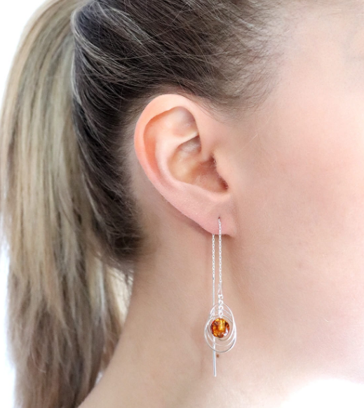 Original Baltic amber ball and circle earrings hanging on a silver chain