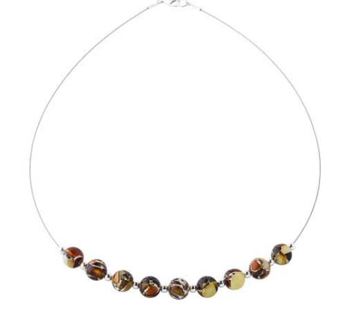 A subtle necklace with pressed amber balls